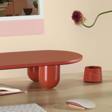 Light wood Scandinavian monitor stand elevating laptop in minimalist workspace