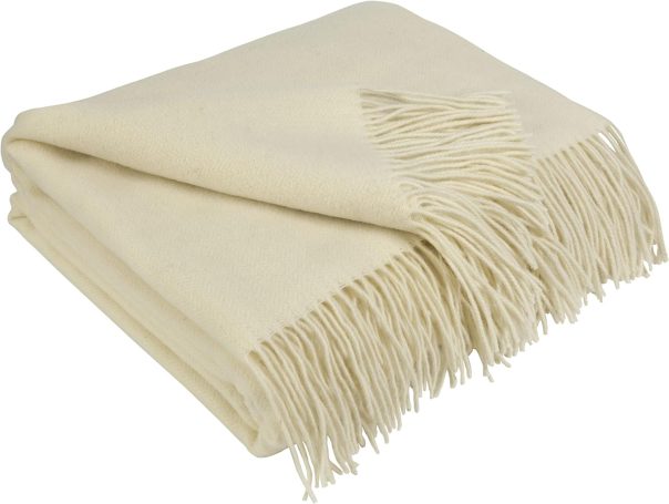Luxurious ivory cashmere-blend throw blanket draped elegantly across the end of a minimalist bed for a refined autumn touch.