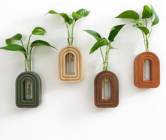 Scandinavian-style hanging planters adding greenery and natural textures to a minimalist home office desk