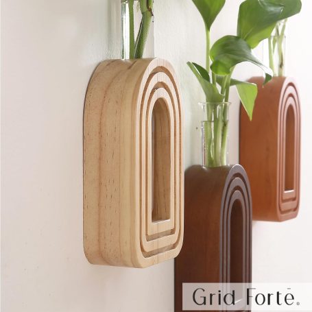 Scandinavian-style hanging planters adding greenery and natural textures to a minimalist home office desk