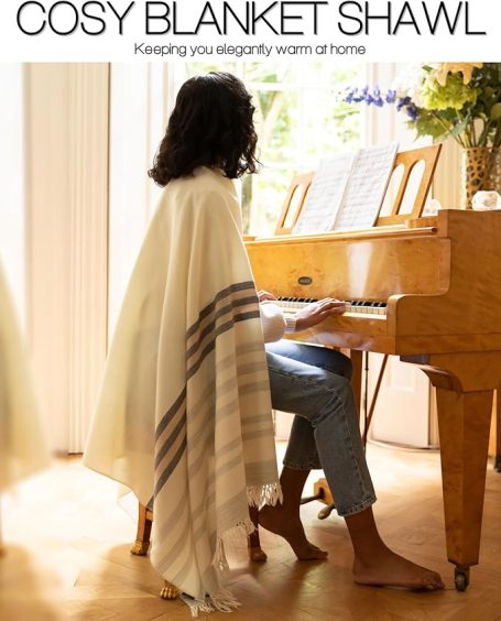 Lightweight shawl-style blanket wrap in neutral fabric, can be used  both as a cozy sofa throw and as a wearable autumn layer.